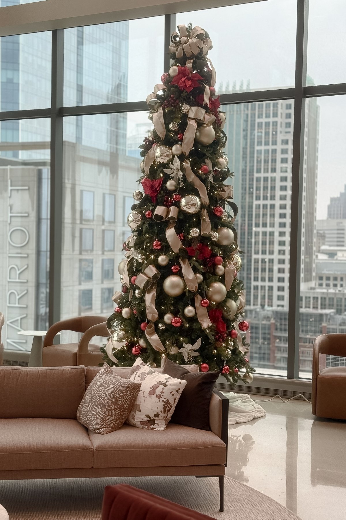 Large-scale commercial Christmas tree installation designed for a luxury residential or commercial space
