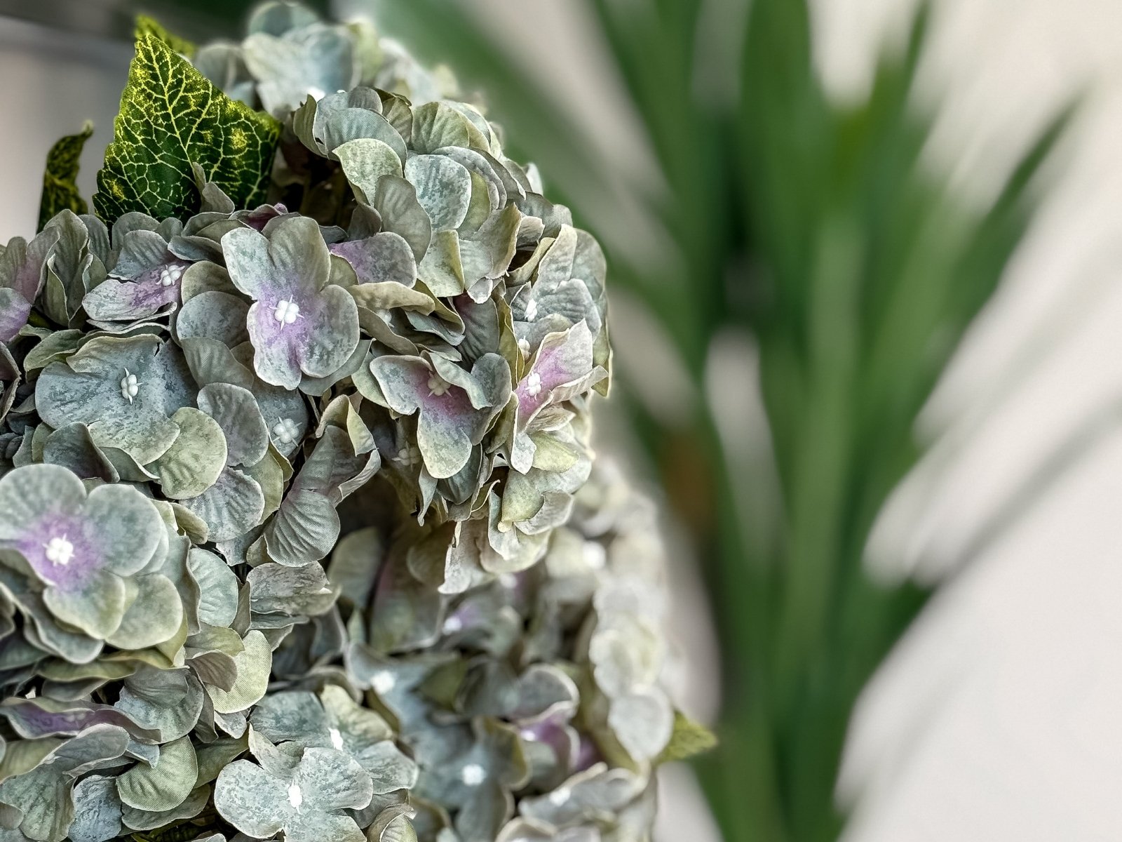 Close-up of textured floral arrangement styled for an elevated interior vignette